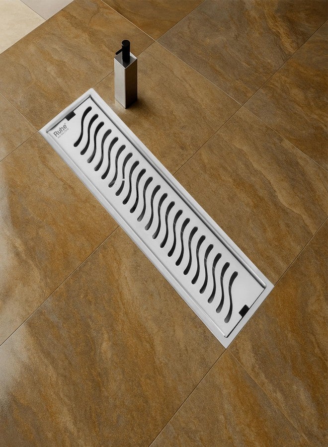 روهي قناة تصريف مياه الدش Ruhe® Wave | 18 × 4 بوصات | قناة تصريف مياه الدش من الفولاذ المقاوم للصدأ 304 | مصرف أرضي مزود بمصيدة للصراصير، وفتحة جانبية، وطوق - Image 1